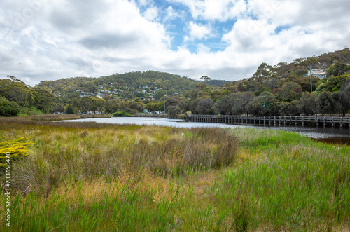 Riverbank of the Erskine River with the resort town of Lorne on Great Ocean Road in the distance. Lorne is a regional seaside town in Victoria, Australia. photo