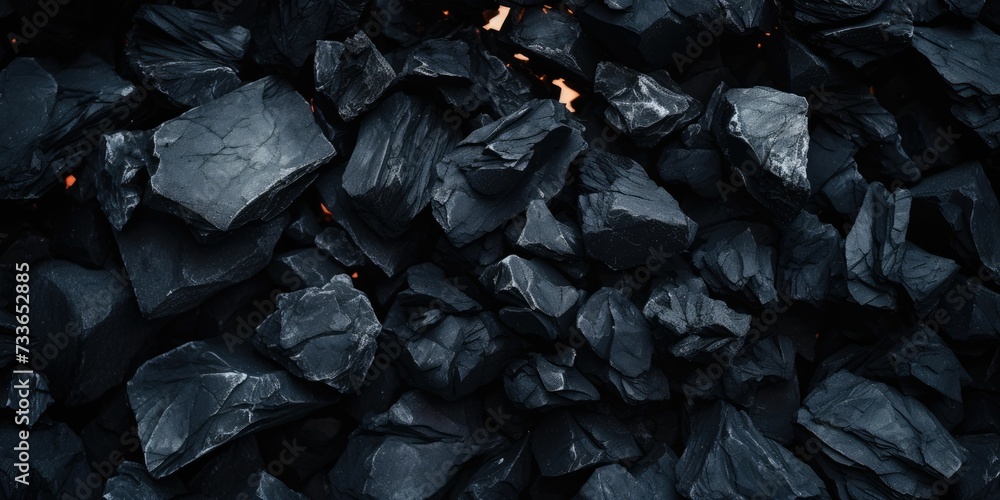 Hot coal pieces background, top view, close up 