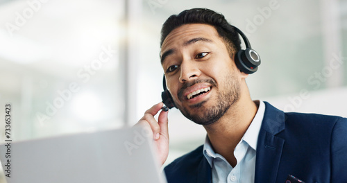 Laptop, problem solving and business man in call center with headset for customer support or service. Smile, computer and consulting with happy employee working in tech agency for contact us online