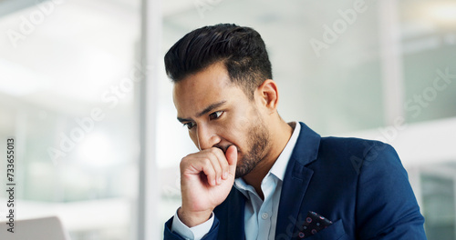 Business man, thinking and stress on computer for legal research, law firm problem solving or decision in office. Aisan person or lawyer with doubt, mistake or ideas on laptop for report or article photo