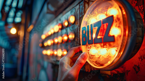 Buzz concept image with person hand touching a big buzzer button with written Buzz word © Keitma