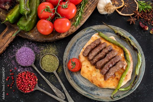 Grilled burgers on the pita bread named cevapi , souvlaki , şiş or inegöl köfte