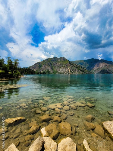 A beautiful mountain lake with crystal clear water and wavy surface. The rocky bottom and inaccessible shores add to the severity of this species.