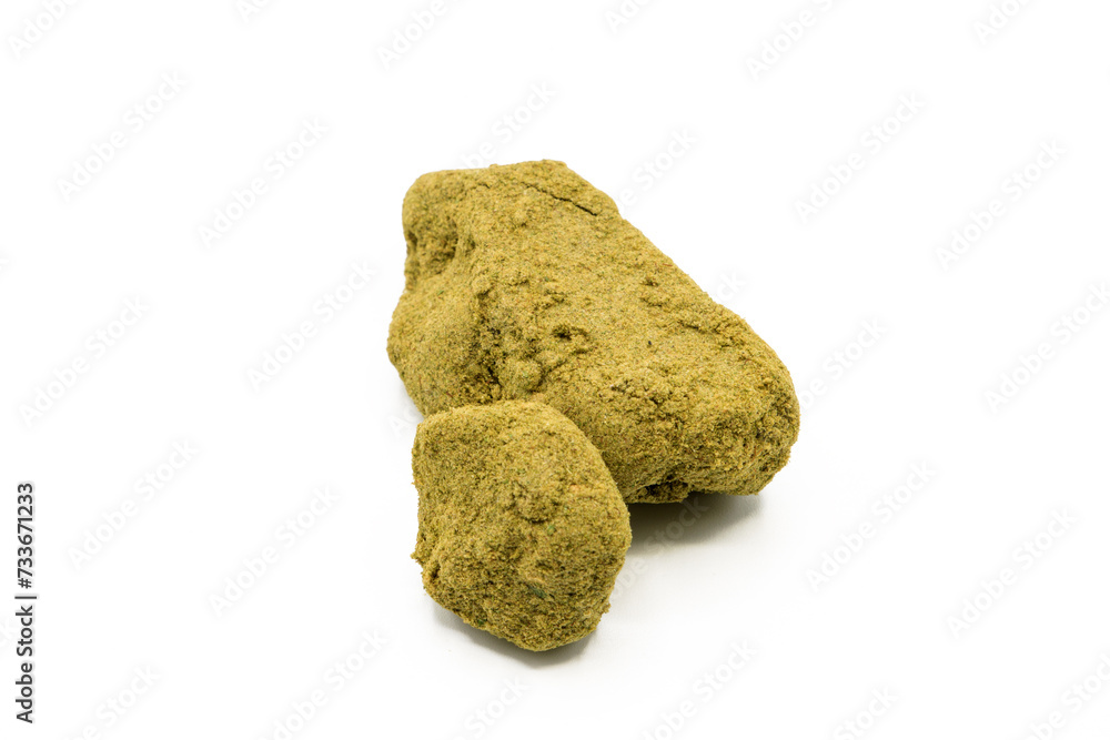 Closeup of piece of hashish pollen isolated on white background Closeup of piece of hashish pollen isolated on white background