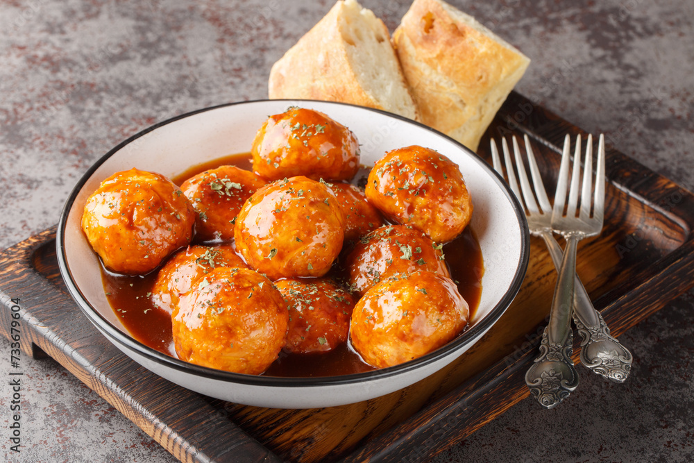 Chicken Meatballs with Chipotle Honey Sauce closeup on the bowl on the table. Horizontal Chicken Meatballs with Chipotle Honey Sauce closeup on the bowl on the table. Horizontal