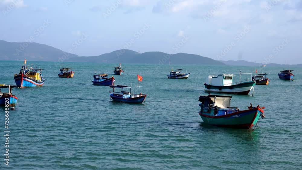 Vietnamese boats in a sea at sunrise. Nha Trang, Vietnam travel landscape and destinations. Vietnamese boats in a sea at sunrise. Nha Trang, Vietnam travel landscape and destinations.