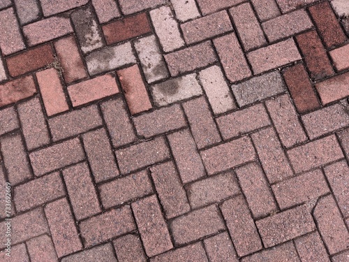 Wet Red stone block paving after the rain