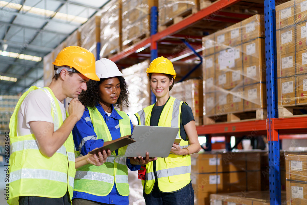 team of warehouse personnel is conducting a comprehensive stock inventory using laptop computers within the confines of the warehouse. team of warehouse personnel is conducting a comprehensive stock inventory using laptop computers within the confines of the warehouse.