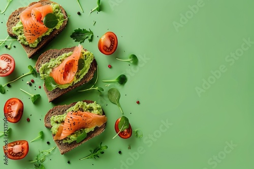Open sandwiches toasts with salted salmon, avocado guacamole, roasted chickpeas
