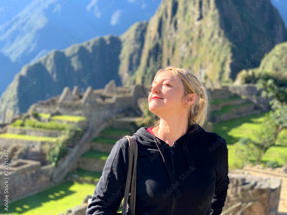 Happy woman in the Machu Picchu Peru.