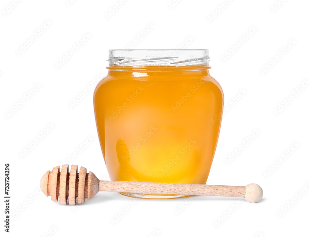 Tasty natural honey in glass jar and dipper isolated on white Tasty natural honey in glass jar and dipper isolated on white