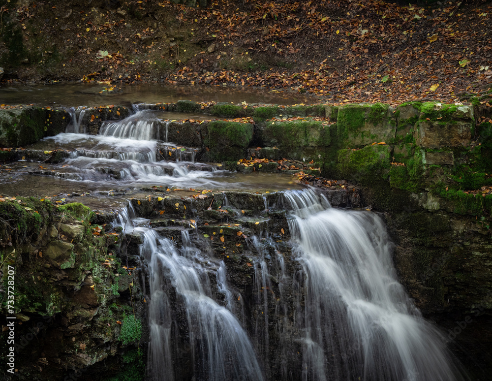 Fototapeta premium The waterfall in green forest.