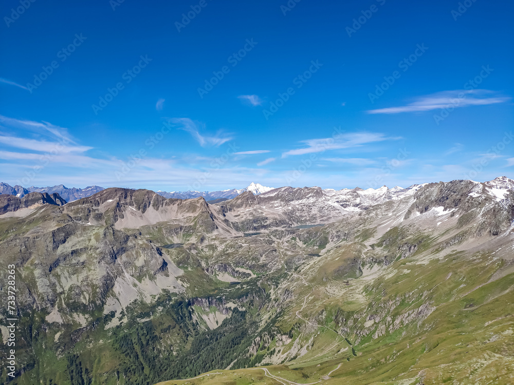Panoramic view of majestic mountain peaks of High Tauern seen from Feldseekopf, Carinthia Salzburg, Austria. Idyllic hiking trail in Goldberg group in wilderness of Austrian Alps. Grossglockner