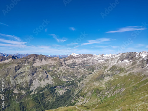 Panoramic view of majestic mountain peaks of High Tauern seen from Feldseekopf, Carinthia Salzburg, Austria. Idyllic hiking trail in Goldberg group in wilderness of Austrian Alps. Grossglockner