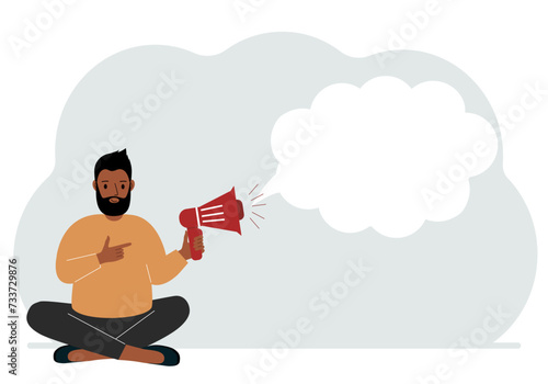 A man with a mouthpiece in his hand sits cross-legged. From loudspeaker bubbles to accommodate text.