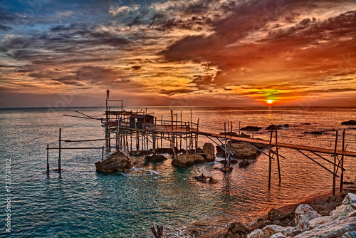 Rocca San Giovanni, Chieti, Abruzzo, Italy: landscape of the Adriatic sea coast at dawn with an ancient fishing hut trabocco, the typical Mediterranean wooden pilework