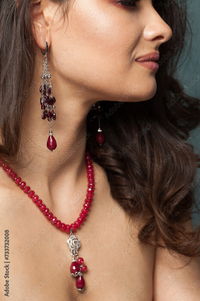 Fashionable jewelry model. Woman with bijou close up
