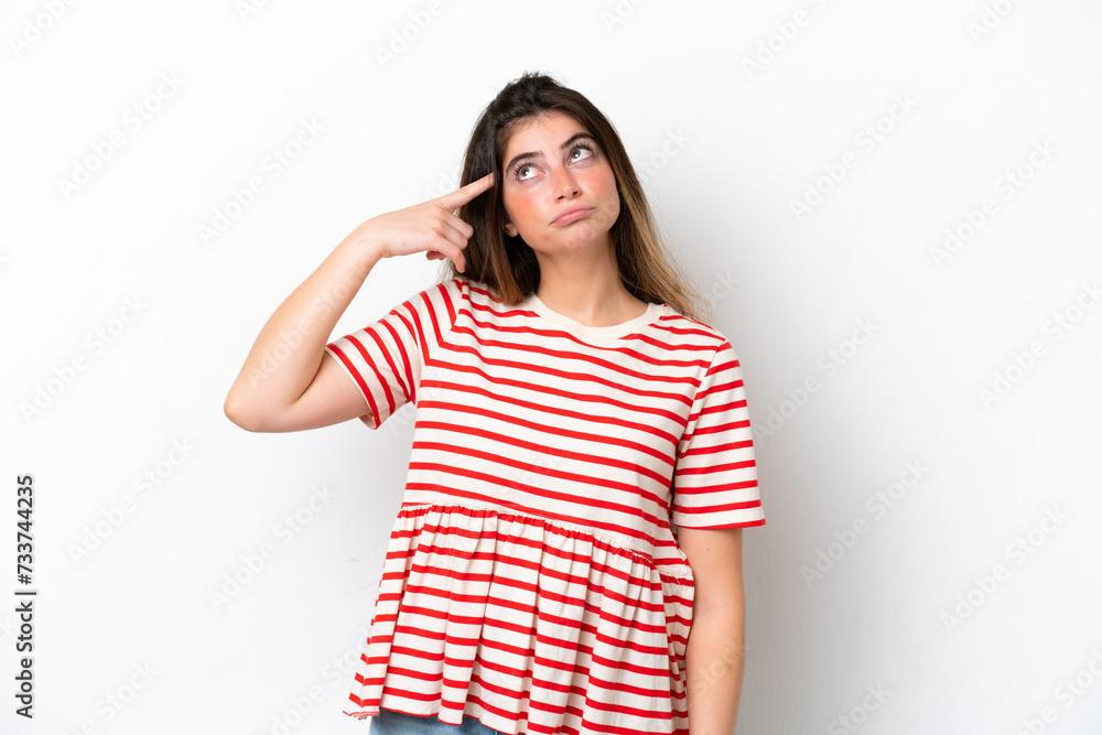 Young caucasian woman isolated on white background making the gesture of madness putting finger on the head Young caucasian woman isolated on white background making the gesture of madness putting finger on the head