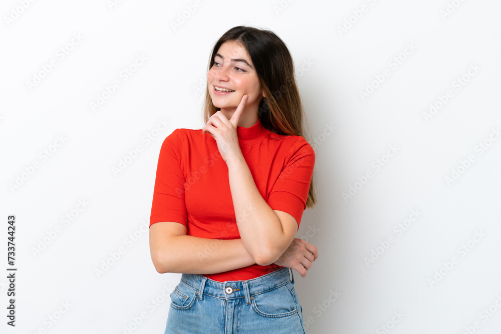 Young caucasian woman isolated on white background thinking an idea while looking up Young caucasian woman isolated on white background thinking an idea while looking up