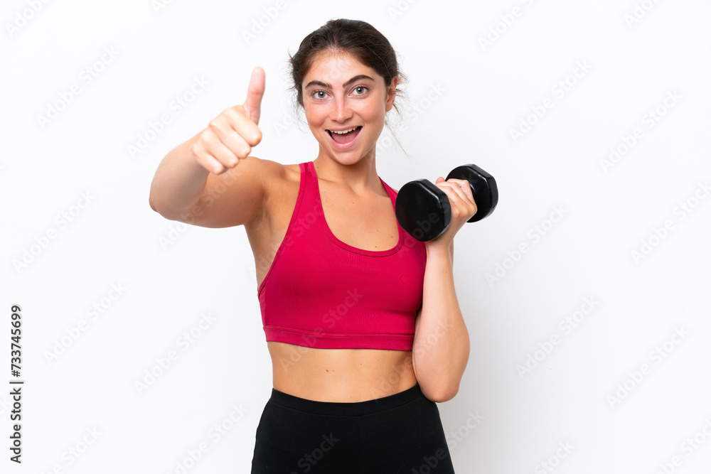 Young sport caucasian woman making weightlifting isolated on white background with thumbs up because something good has happened Young sport caucasian woman making weightlifting isolated on white background with thumbs up because something good has happened