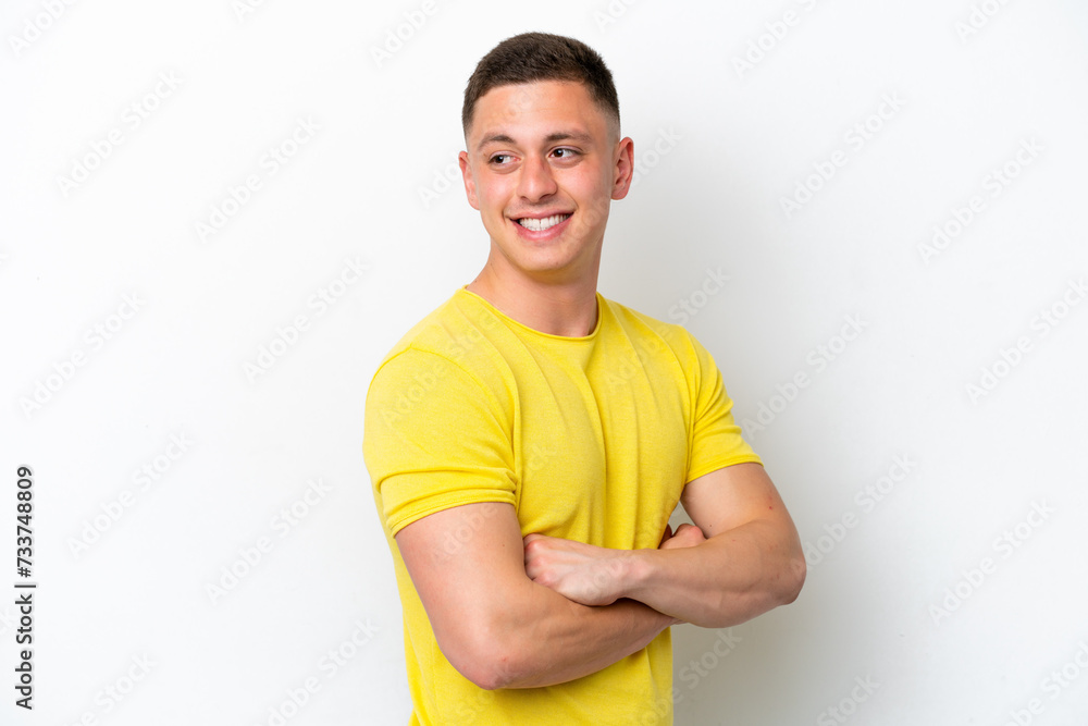 Young brazilian man isolated on white background with arms crossed and happy Young brazilian man isolated on white background with arms crossed and happy