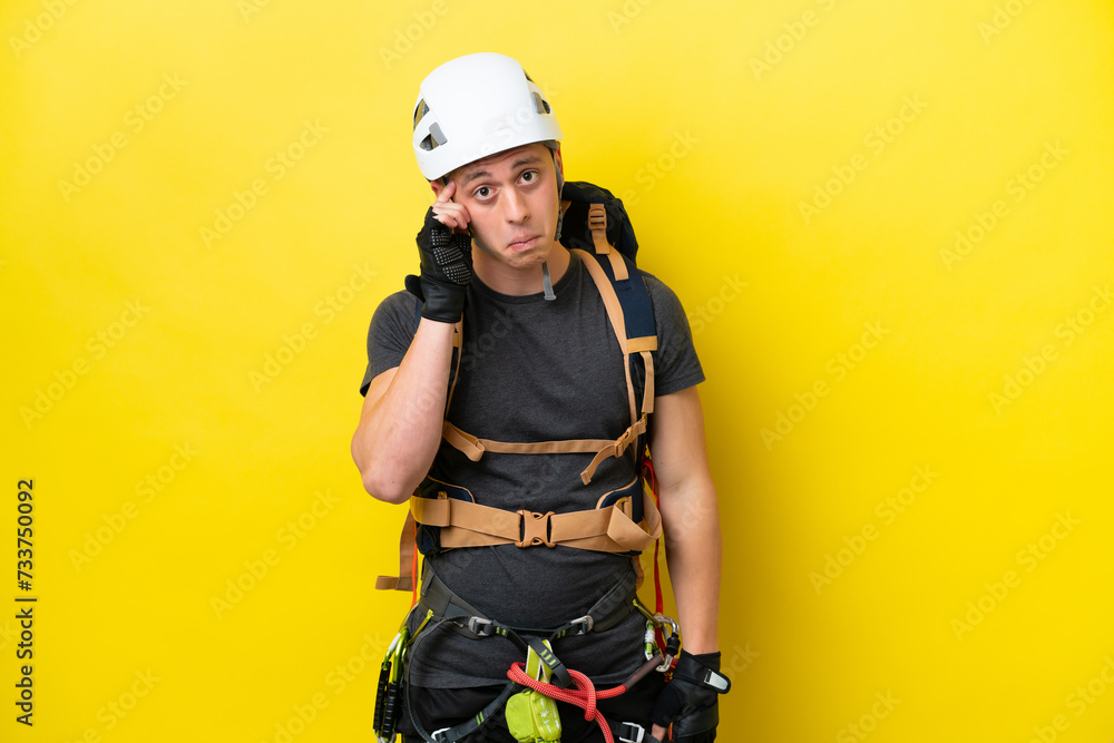 Young rock climber Brazilian man thinking an idea Young rock climber Brazilian man thinking an idea