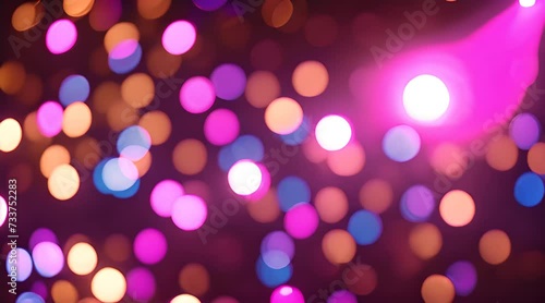 Vibrant disco party lights illuminating a room filled with blurred circles, creating a lively and energetic atmosphere, perfect for background photo