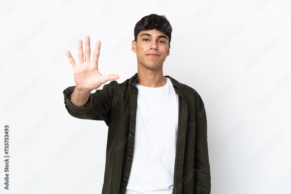 Young man over isolated white background counting five with fingers