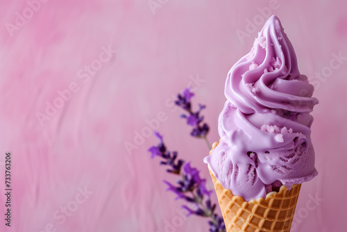 lavender ice cream in a cone closeup with lavade flowers with copy space on the left on a lavender background photo