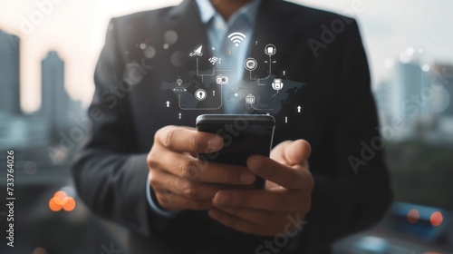 Businessman using smartphone with connection and internet services icons
