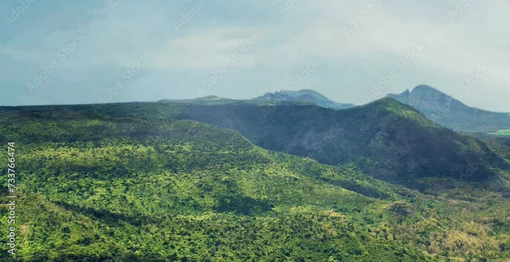 The view of the mountains is very beautiful with mist enveloping it accompanied by blue sky and clear clouds The view of the mountains is very beautiful with mist enveloping it accompanied by blue sky and clear clouds