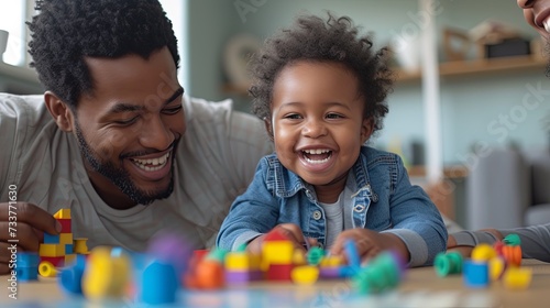 close-up stock photo of a parent participating in an early intervention session with their child photo