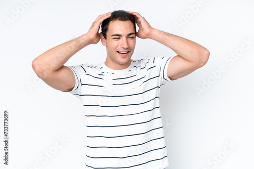 Young caucasian man isolated on white background laughing