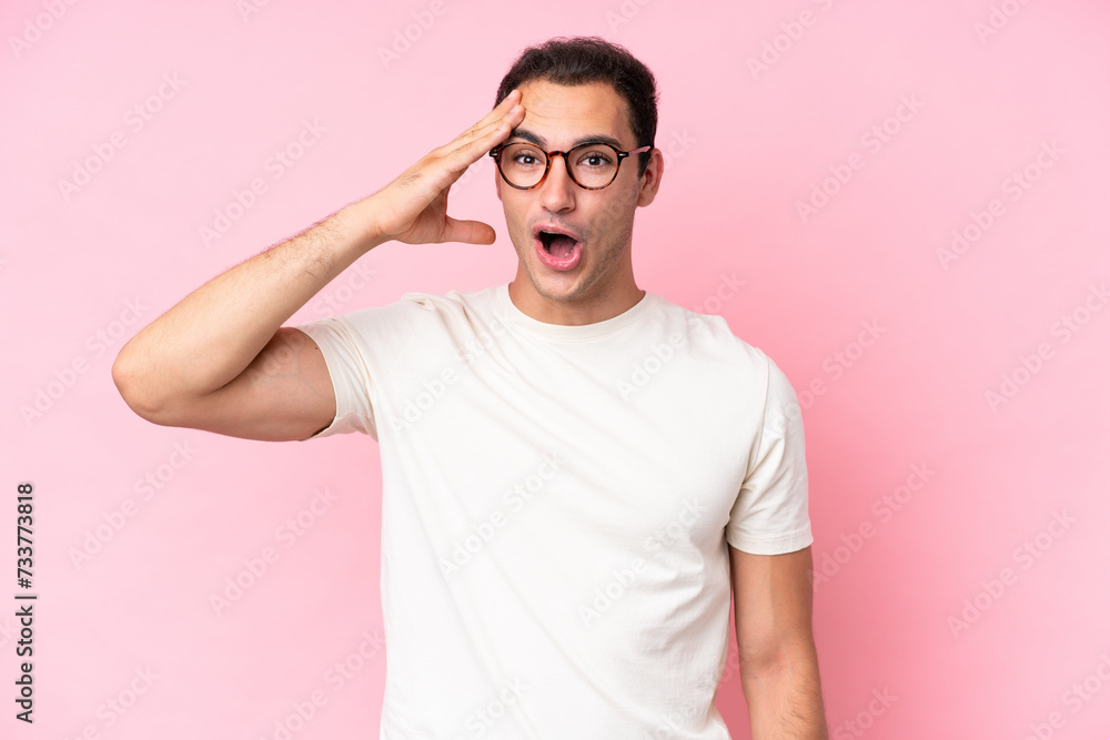 Young caucasian man isolated on pink background has realized something and intending the solution Young caucasian man isolated on pink background has realized something and intending the solution