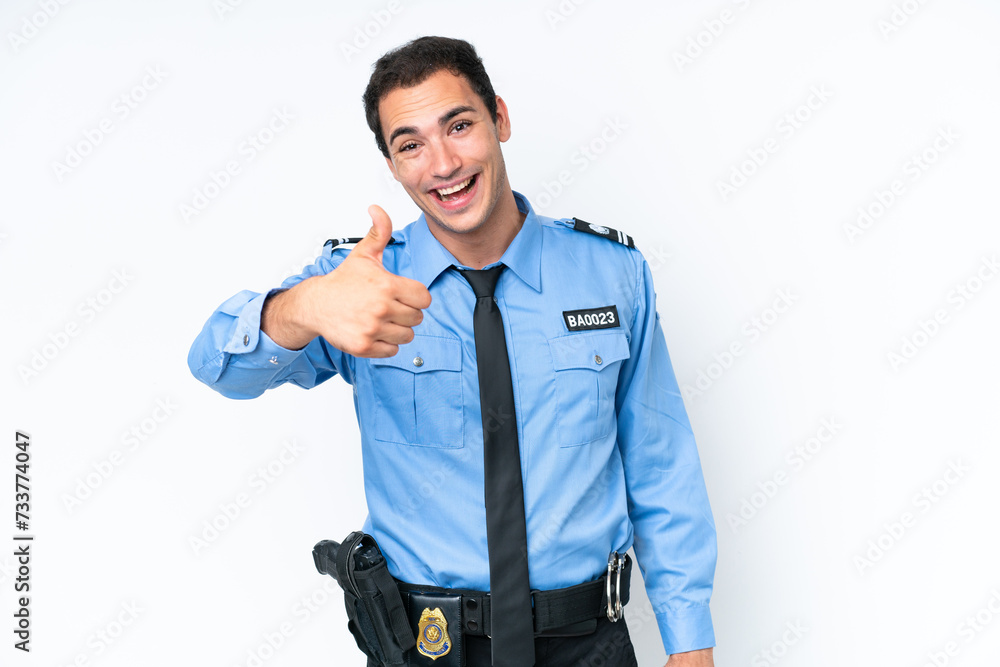 Young police caucasian man isolated on white background with thumbs up because something good has happened Young police caucasian man isolated on white background with thumbs up because something good has happened