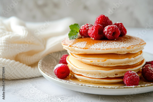 Stack of Pancakes With Raspberries on a Plate