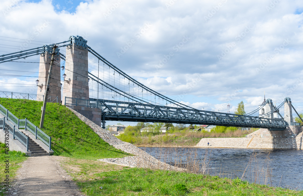 Fototapeta premium Unique Chain Bridges over the Velikaya River. Suspension bridge over the Velikaya River in the city of Ostrov. Pskov region. Russia