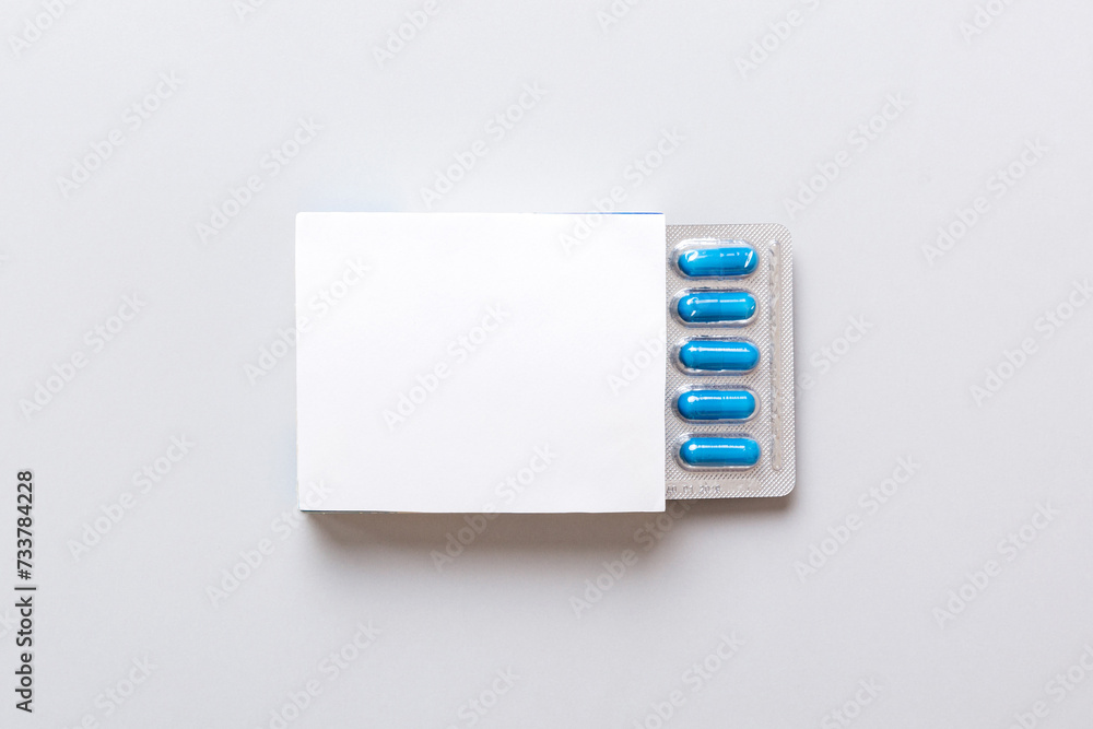 Blank White Product Package Box Mock-up. Open blank medicine drug box with blue pills blister top view - obrazy, fototapety, plakaty 