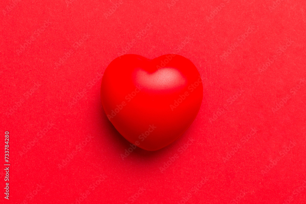 red heart shape on colored background. minimal concept top view with copy space red heart shape on colored background. minimal concept top view with copy space