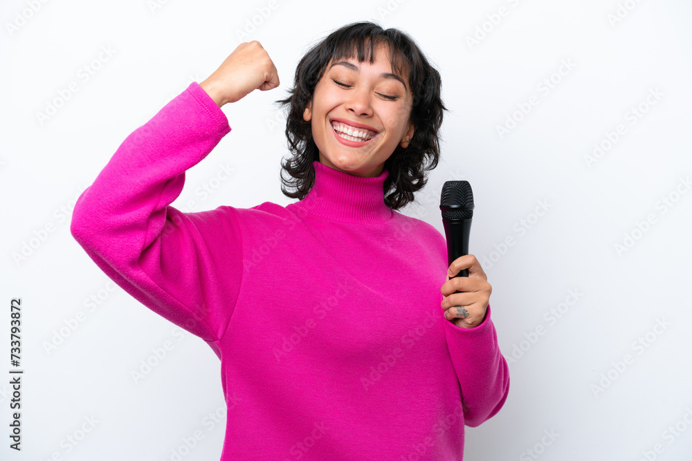 Young Argentinian singer woman isolated on white background doing strong gesture Young Argentinian singer woman isolated on white background doing strong gesture