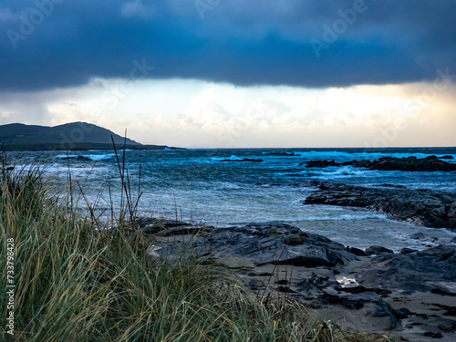 Dramatic clouds at Carrickfad by Portnoo at Narin Strand in County Donegal Ireland photo
