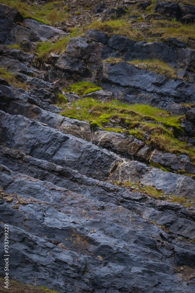 wet black rocks in a rainy day 
