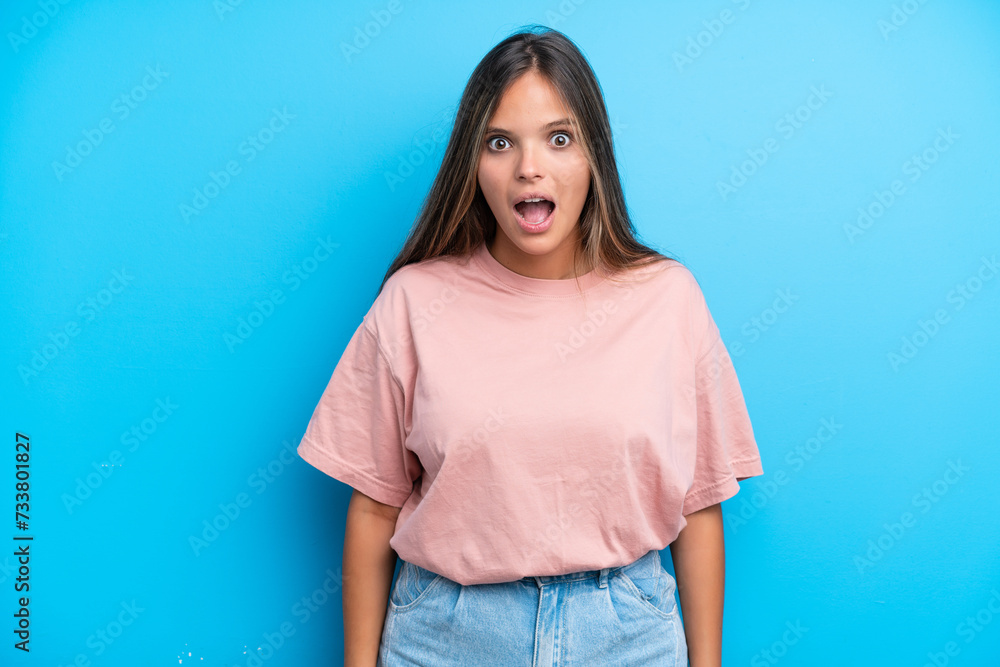 Young caucasian woman isolated on blue background with surprise facial expression Young caucasian woman isolated on blue background with surprise facial expression