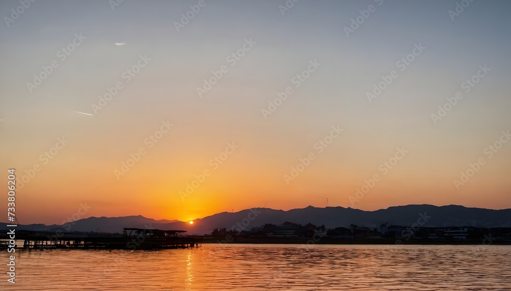 Naklejka premium sunset over lake