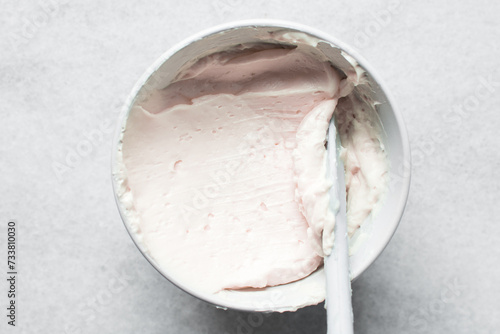 pink buttercream in a white mixing bowl, American buttercream in a bowl for icing cake, frosting for decorating cake photo