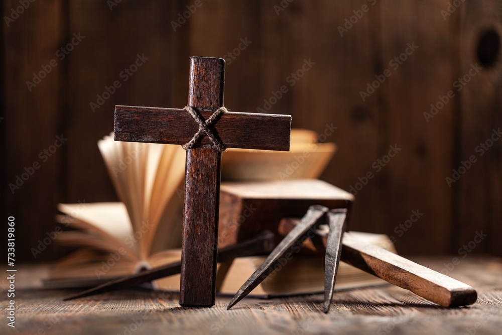 Praying wooden cross and Holy Bible book. Religion concept