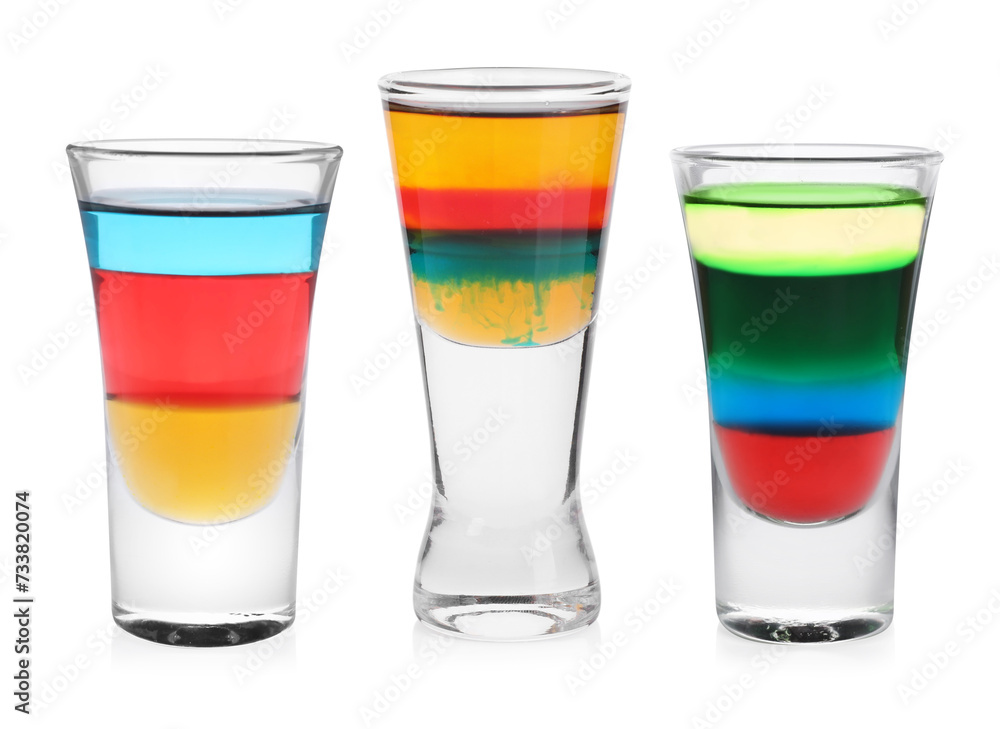 Different shooters in shot glasses isolated on white, set Different shooters in shot glasses isolated on white, set