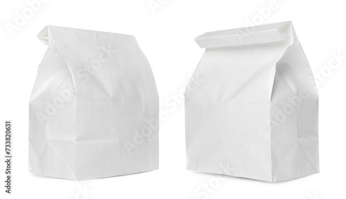 Closed white paper bags isolated on white