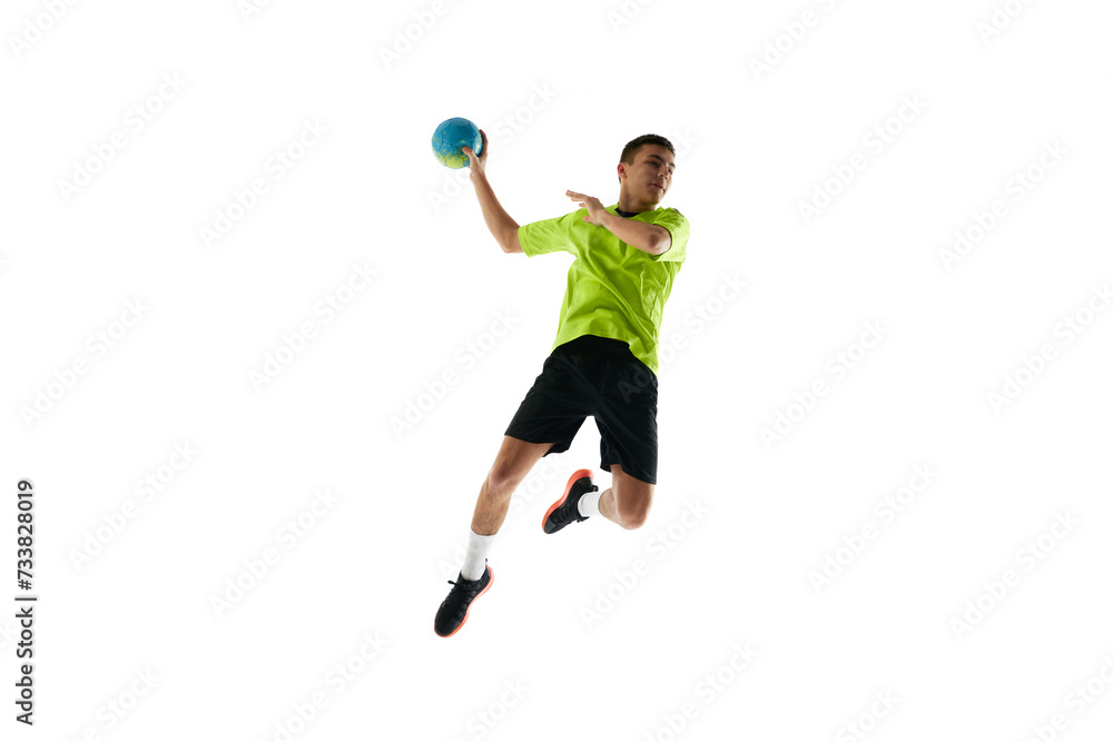 Dynamic image of young man in uniform, handball player in motion during game, practicing, jumping with ball against white studio background. Concept of professional sport, tournament, competition Dynamic image of young man in uniform, handball player in motion during game, practicing, jumping with ball against white studio background. Concept of professional sport, tournament, competition