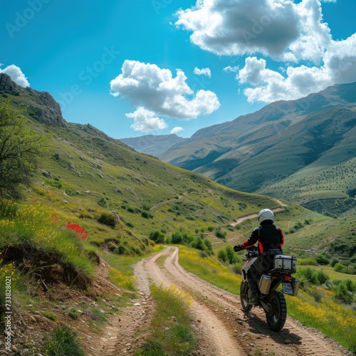 A person rides a trail motorbike  usually called a dual sport or all road  drifting on winding roads on top of extreme mountains with stunning views as a backdrop. Generative Ai